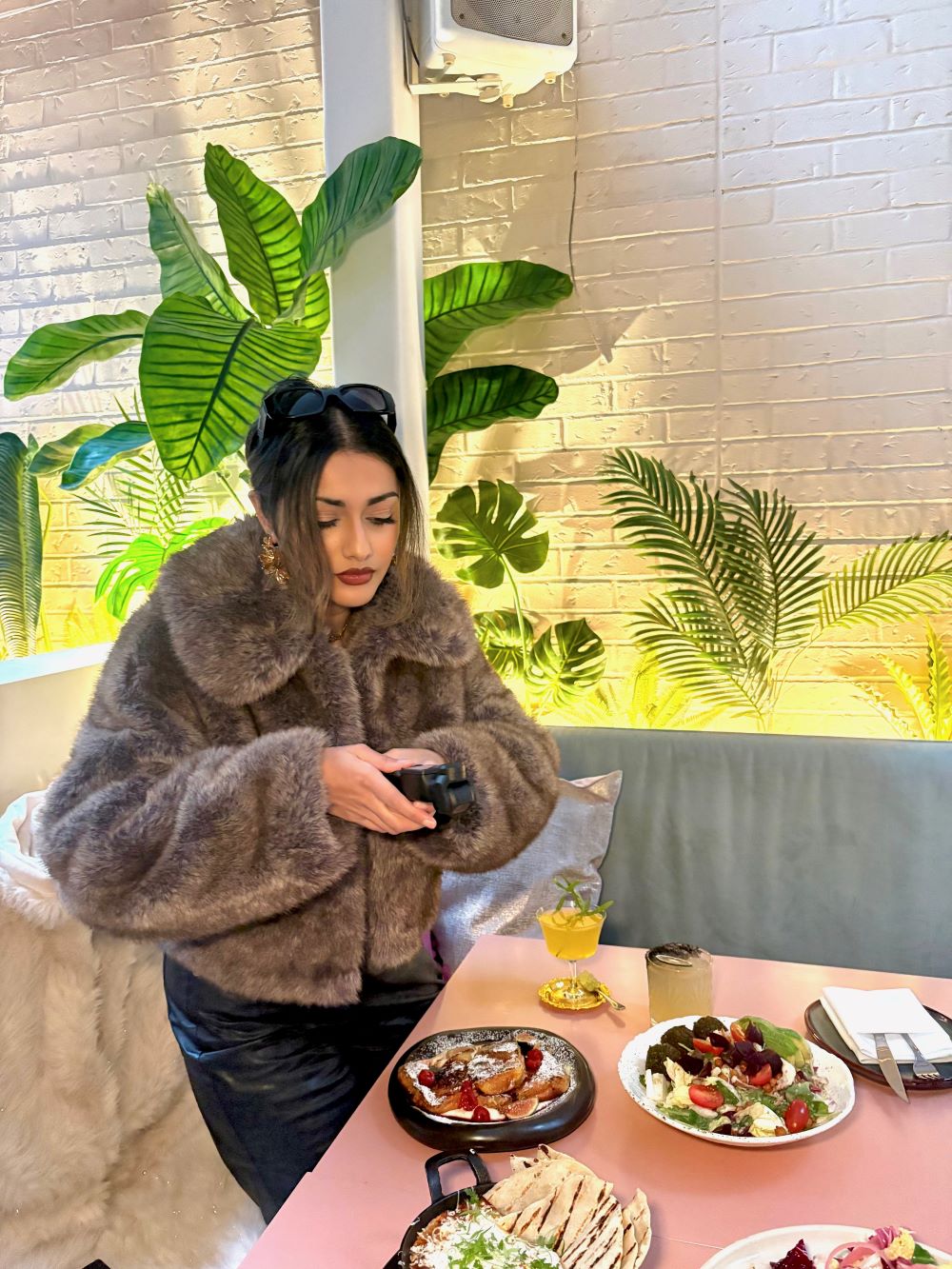 Pree shooting content at a restaurant
